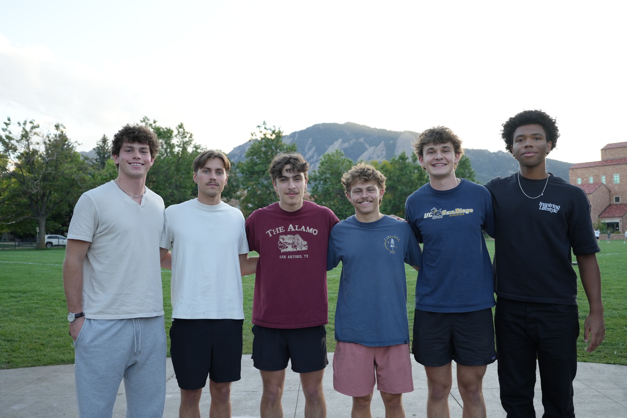 Students standing together outside on campus